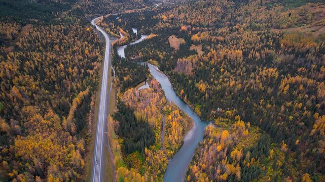 Aerial view of scenic Seward highway surrounded with colorful fall foliage in autumn time.