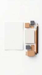 Minimalist layout with blank cards, building blocks, and drawing pencils arranged on a clean, white surface