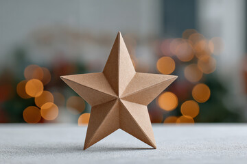 cardboard star glimmers softly against beautifully blurred bokeh background creating depth