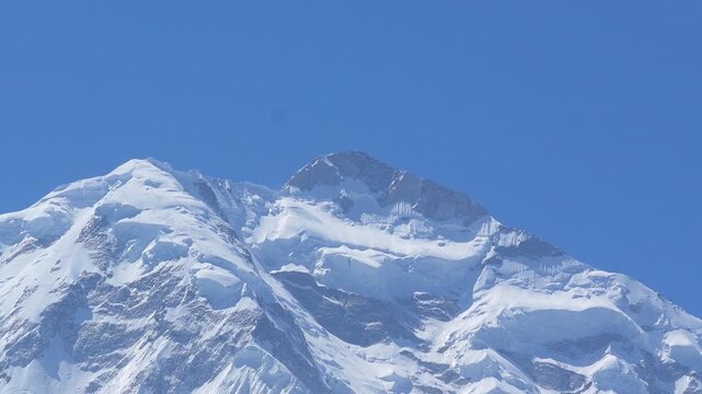K2, also known as Mount Godwin-Austen, the world&rsquo;s second-highest mountain, located in the Karakoram Range on the border of Pakistan and China.K2 120fps Slow Motion 4K Footage of rocky mountain peak.