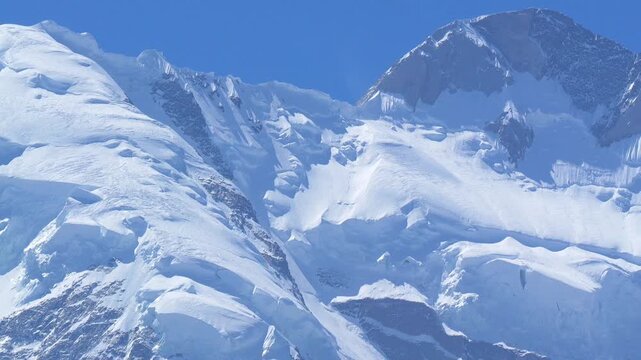 K2, also known as Mount Godwin-Austen, the world&rsquo;s second-highest mountain, located in the Karakoram Range on the border of Pakistan and China.K2 120fps Slow Motion 4K Footage of rocky mountain peak.