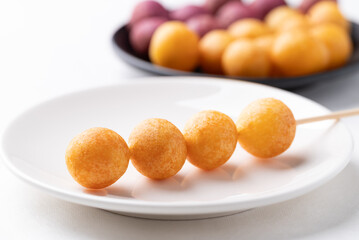 Deep fried sweet potato balls on stick, Thai street food snack