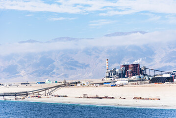 Industrial zone in Mejillones, Puerto Angamos, Chile, near the Atacama Desert. Features include...