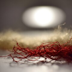 Red and beige yarn threads