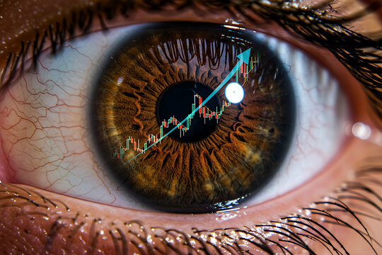 Close-up of a human eye reflecting a stock market graph with an upward trend, symbolizing financial growth, investment, and economic success