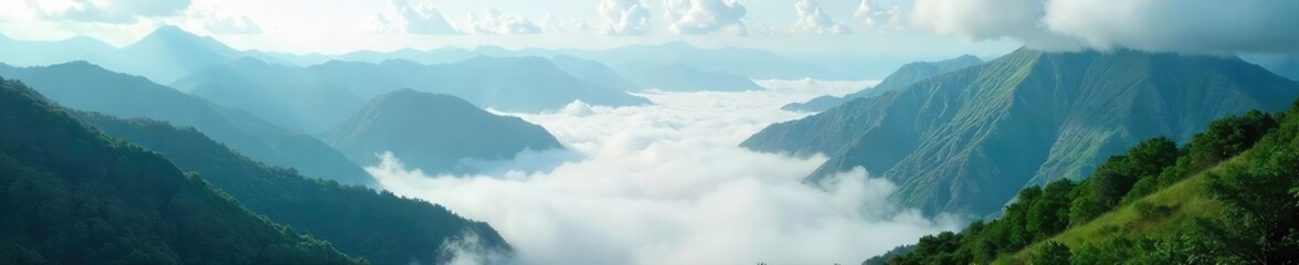 Obraz premium Ethereal Clouds Embrace Lush Green Mountain Peaks A Misty, Otherworldly Paradise