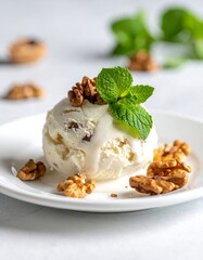 Creamy ice cream scoop with walnuts and mint