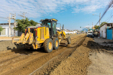 Road construction in progress with workers and machinery