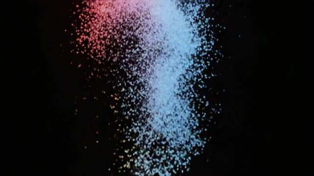 Colorful Particles Falling Down on Black Background.