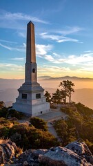 Monument on a mountaintop at sunset