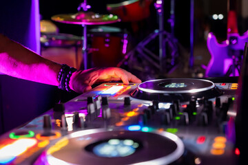 dj at the party with drum set on the background
