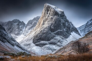 Snowy mountain peak, dramatic light, winter landscape