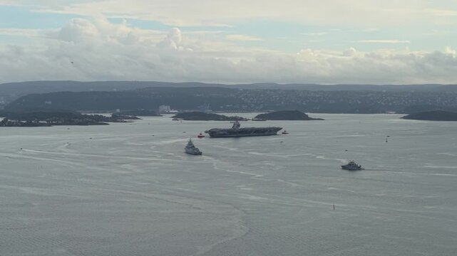 USS Gerald R. Ford Aircraft Carrier Ship For NATO Exercises In Oslo Fjord, Norway. - aerial sot