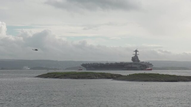 Helicopter Fly Over The USS Gerald R. Ford In Oslo Fjord, Oslo, Norway. - wide shot