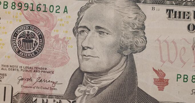 US President Hamilton on United States. American ten dollar paper banknote zoom in close up macro. Ten USD cash macro view. 10 Dollar Cash. Ten Dollar Closeup. Rich business economy of usa.
