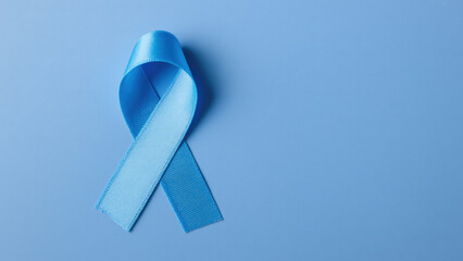 Light blue ribbon on blue for diabetes awareness, created AI