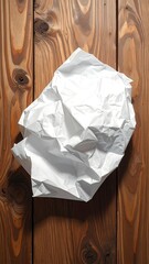 Crumpled white paper on wood
