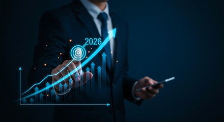 Businessman in a suit pointing at a glowing blue upward trending financial graph with digital data overlay signifying growth and success
