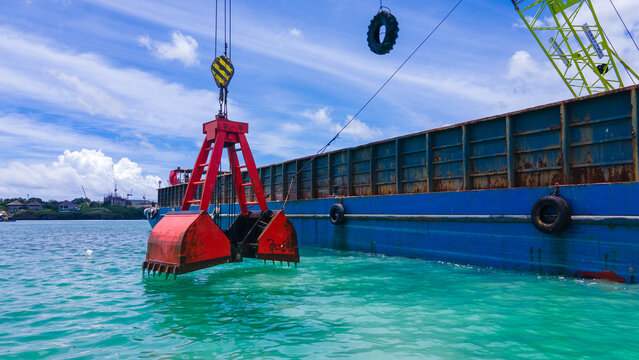 Marine Dredging Barge with Crane Excavating Seabed Soil