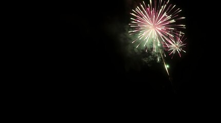 Fototapeta premium A low-contrast, gently lit, moody photographic depiction of a night sky ablaze with vibrant, diffused fireworks, casting subtle illumination and soft shadows