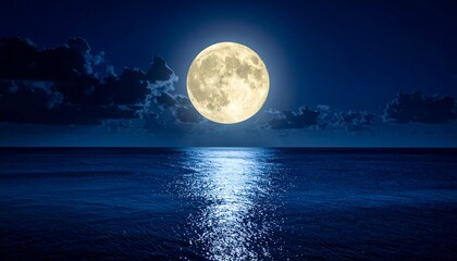 Full moon over calm ocean at night