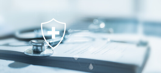 Stethoscope on medical documents with digital shield and cross icon, symbolizing health insurance, medical care, patient safety, and healthcare protection services.