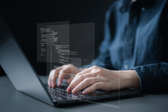 Close-up of programmer typing on laptop with digital code overlay, symbolizing software development, coding, IT engineering, and modern technology innovation.