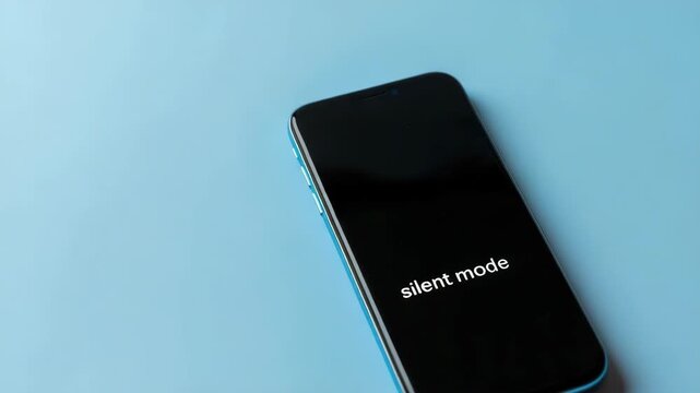 Smartphone with black screen in silent mode, on blue background