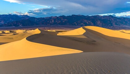Golden dunes against a mountain backdrop