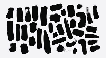 Dynamic black brush strokes scattered across a crisp white background offer modern artistic flair and abstract design elements for creative projects