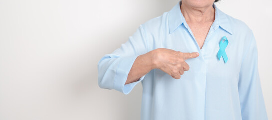 Elderly with blue Ribbon for concept of blue November, November Prostate Cancer Awareness month,...