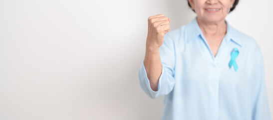 Elderly with blue Ribbon for concept of blue November, November Prostate Cancer Awareness month, World Diabetes day , Men Health month, International men, Father day. Healthcare and world cancer day