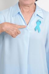 Elderly with blue Ribbon for concept of blue November, November Prostate Cancer Awareness month, World Diabetes day , Men Health month, International men, Father day. Healthcare and world cancer day