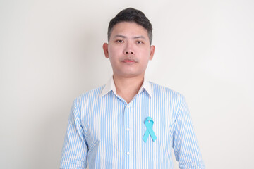 Man with blue Ribbon for concept of blue November, November Prostate Cancer Awareness month, World...