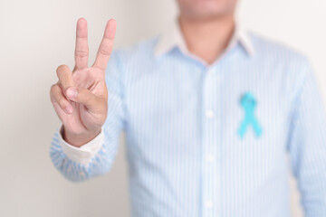 Man with blue Ribbon for concept of blue November, November Prostate Cancer Awareness month, World...
