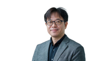 Smiling asian man wearing glasses and a patterned jacket isolated on transparent background.