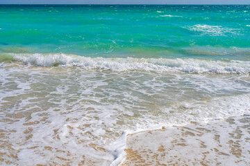 Sea waves. Summer background. Ocean water motion. Ocean splash wave background. Deep blue sea beach. Turquoise wave background. Dreamy exotic sea beach background.