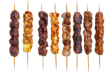 Assortment of grilled meat skewers isolated on transparent background. Set of delicious grilled kebabs on skewers isolated on white background.