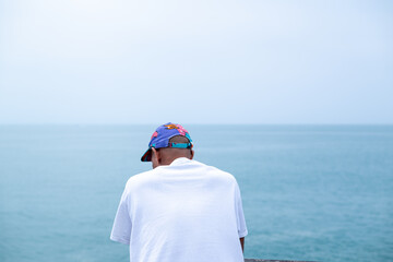 Contemplative man seen staring at the ocean