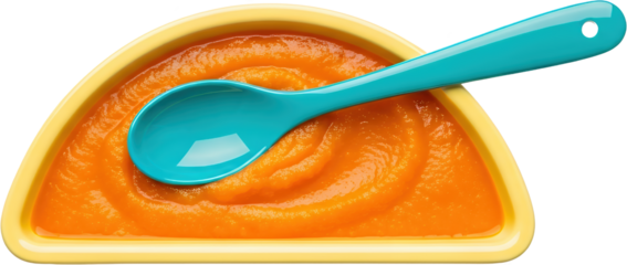 Close up view of orange puree in a yellow bowl with a blue spoon isolate baby food baby infant toddler