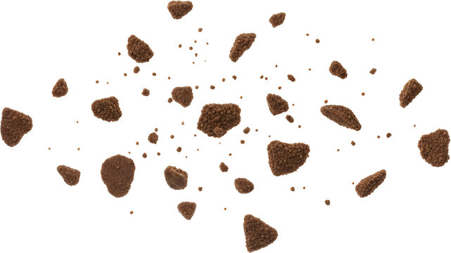 Scattered chocolate cookie crumbs and small pieces floating mid air isolate Food Brown Sweet Biscuit