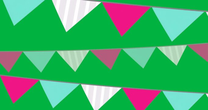 Graphic designers adding pennant garland on transparent layer showing hot pink teal-striped flags