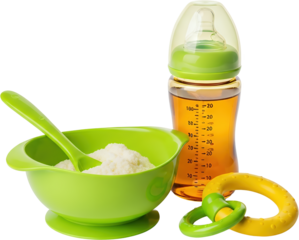 A baby bottle with liquid a green bowl with powder and a spoon and a baby teething toy isolate baby feeding
