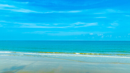 Nature of the ocean and blue sky Summer with sunshine, sandy beaches, clear blue waters sparkling against the blue sky. on an island with good ecology and environment Background for summer vacation