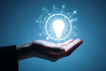 Creative concept showing hand presenting illuminated bulb with digital circuitry
