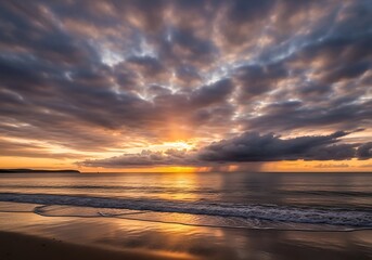 Obraz premium Dramatic sunrise seascape with ominous clouds and radiant sunlight, ocean view