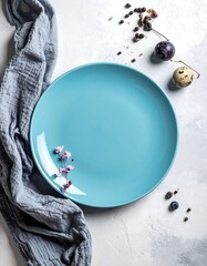 Light blue plate, gray cloth, easter eggs