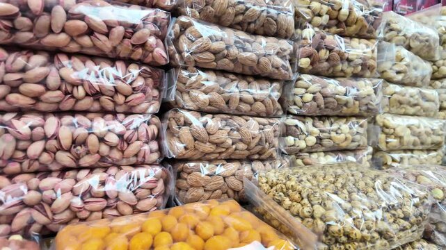 Variety of nuts and dried fruits displayed for sale