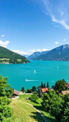 Panoramic view of a turquoise lake nestled between hills