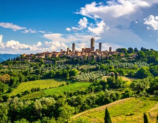 Panoramic view of a Tuscan hill town under a vibrant sky